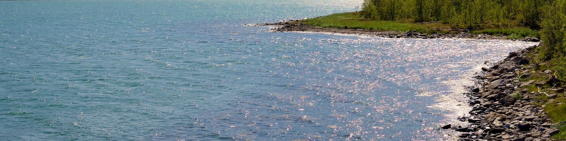 Storfjord showing rugged coastline, general coastal views and mountains