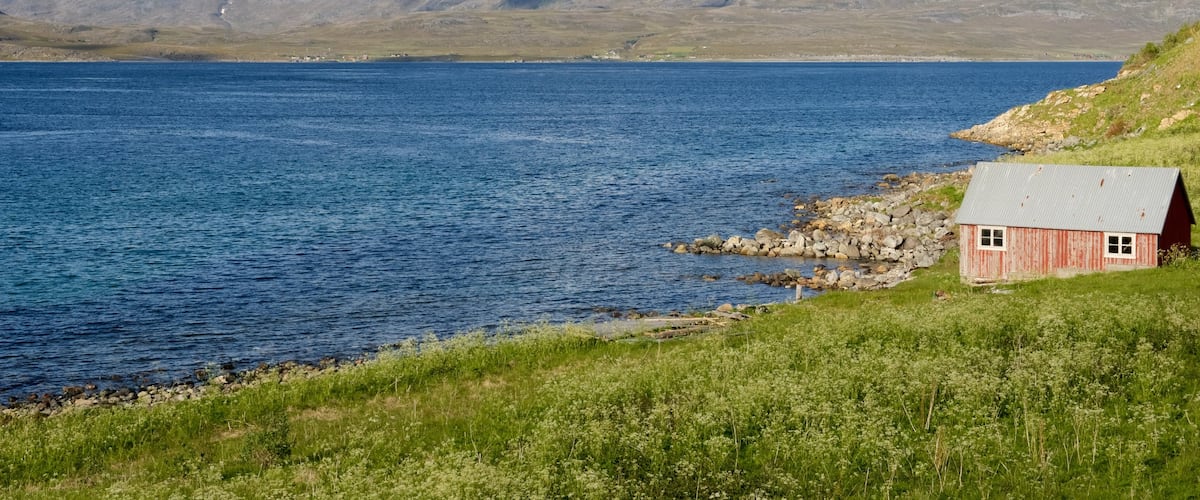 Kvalsund featuring a lake or waterhole and a house