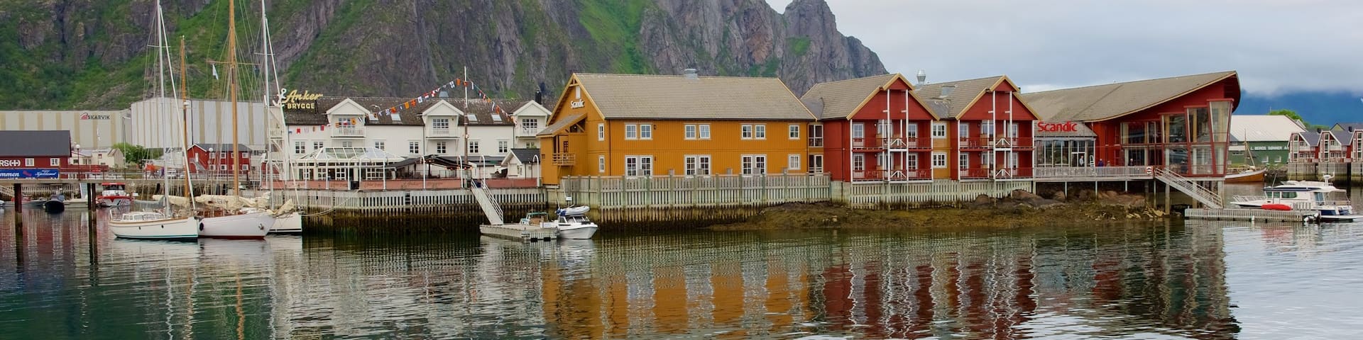 Northern Norway featuring a small town or village, mountains and boating