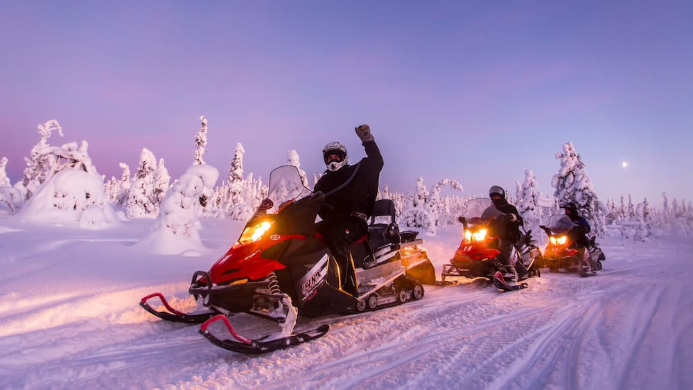 Salla which includes snow, snowmobiling and a sunset