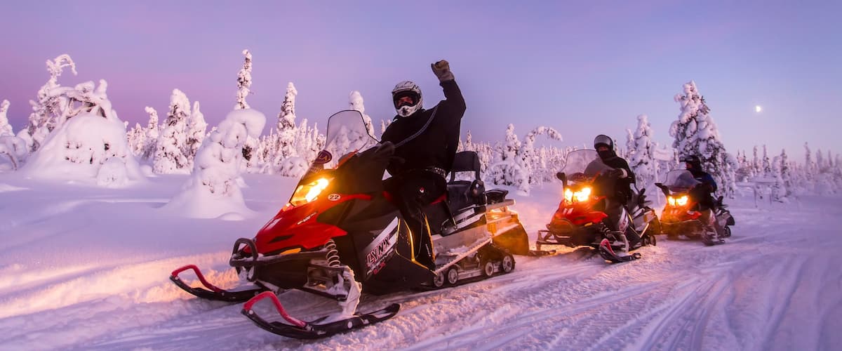 Salla which includes snowmobiling, a sunset and snow
