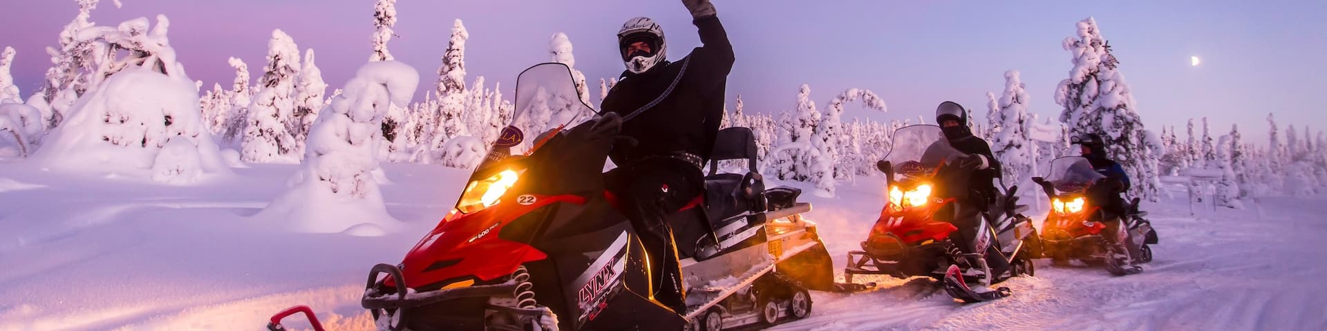 Salla which includes a sunset, snow and snowmobiling