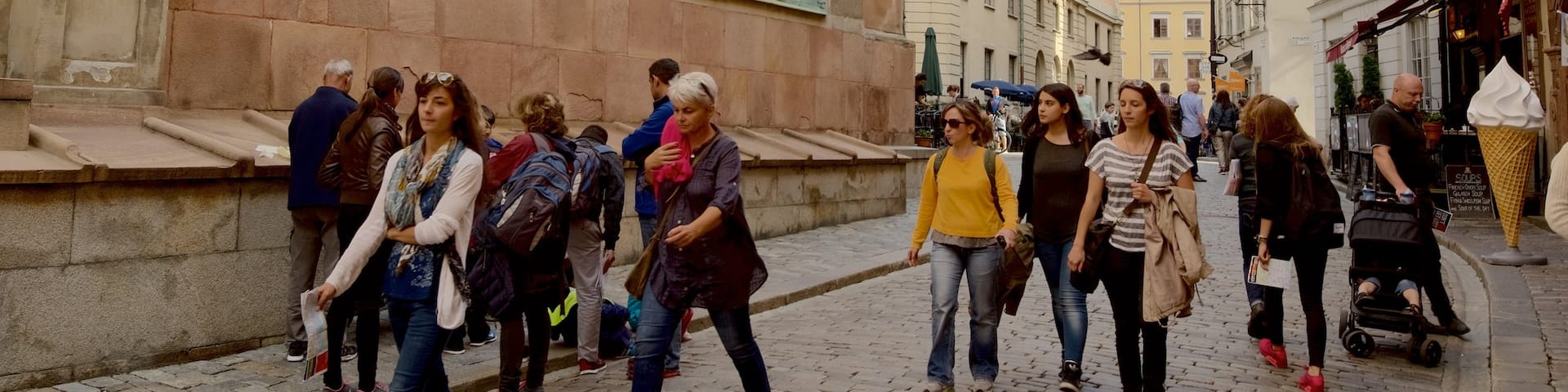 The Great Cathedral of Stockholm which includes heritage architecture as well as a large group of people