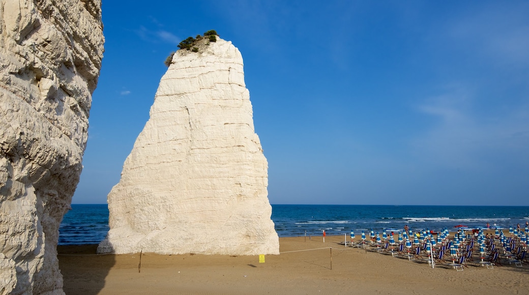 Pizzomuou which includes rugged coastline and a sandy beach