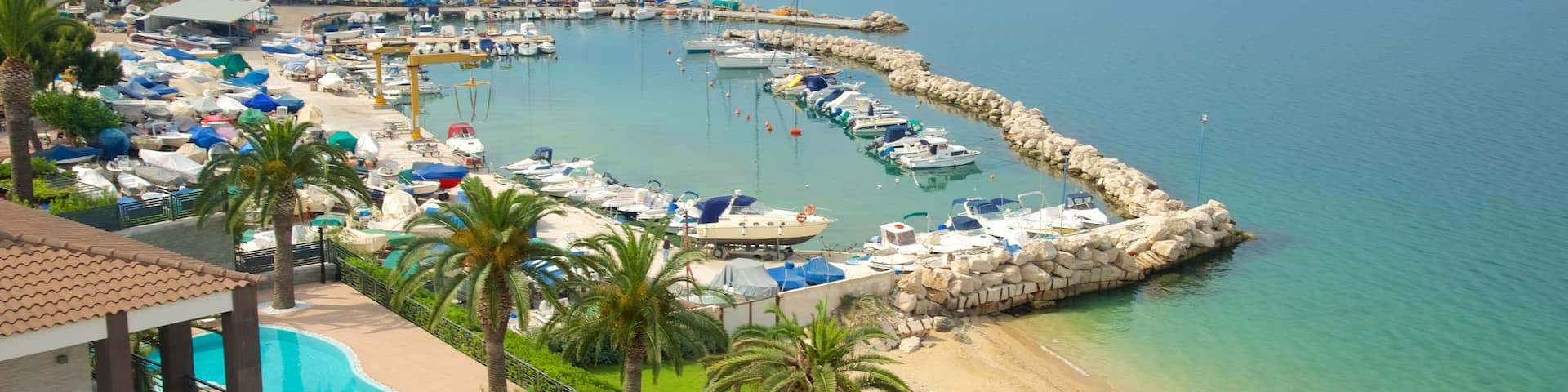 Taranto featuring a beach, a coastal town and general coastal views