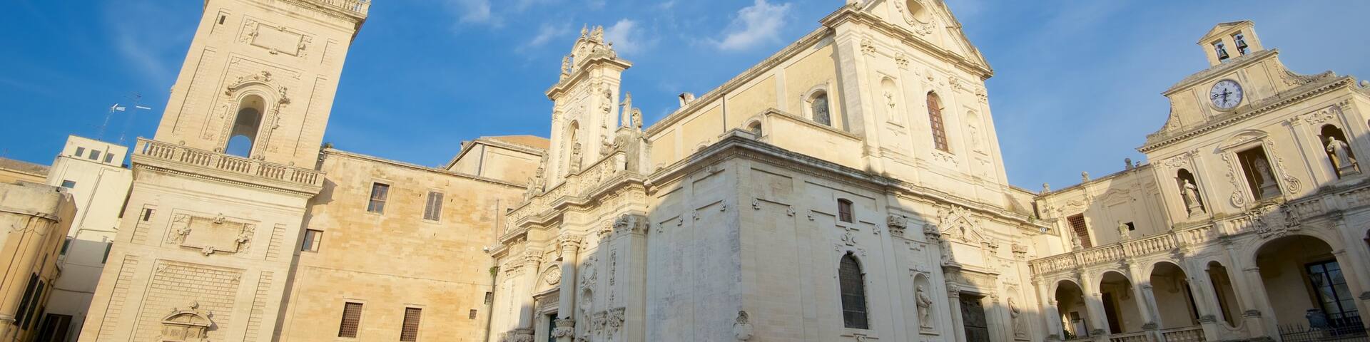 Piazza del Duomo which includes a square or plaza, a church or cathedral and heritage architecture