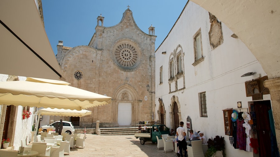 Ostuni Cathedral featuring a church or cathedral, street performance and heritage architecture