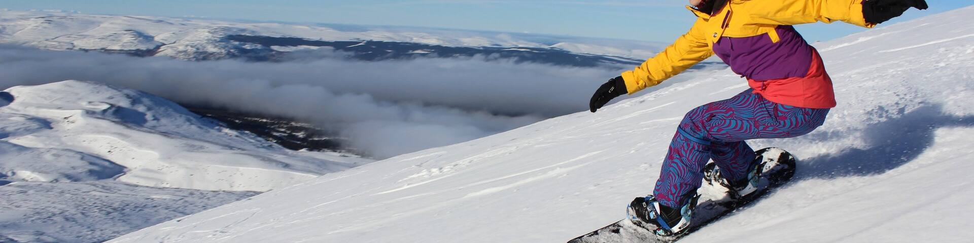 Cairngorm Ski Resort which includes snowboarding and snow as well as an individual female