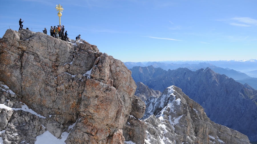 Zugspitze showing mountains as well as a large group of people