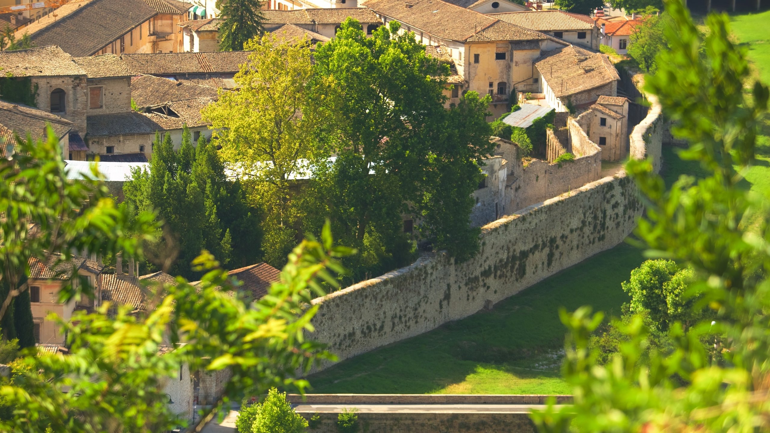 Spoleto featuring a sunset and heritage architecture