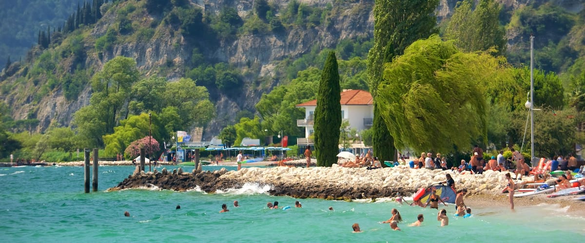 Nago-Torbole featuring general coastal views and rocky coastline