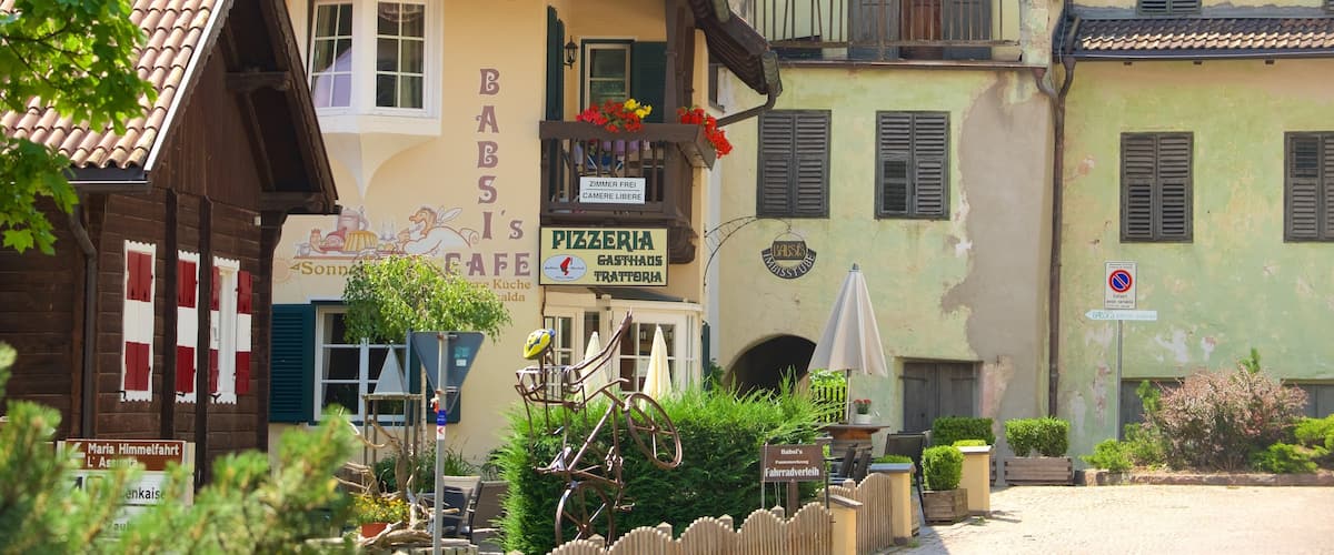 Soprabolzano which includes signage
