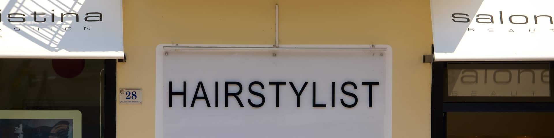 Nago-Torbole featuring signage as well as a small group of people