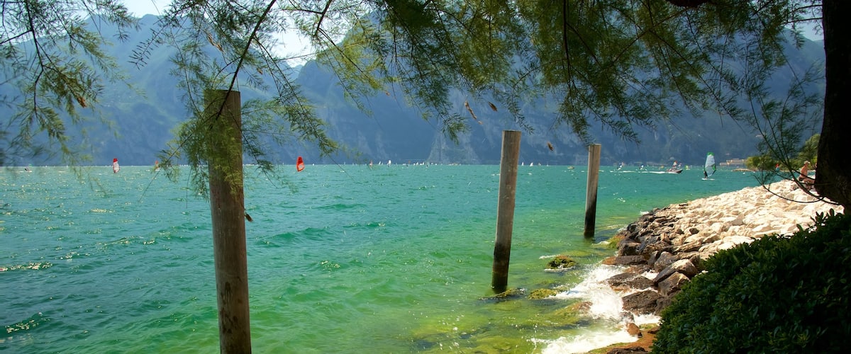 Nago-Torbole which includes rugged coastline and general coastal views