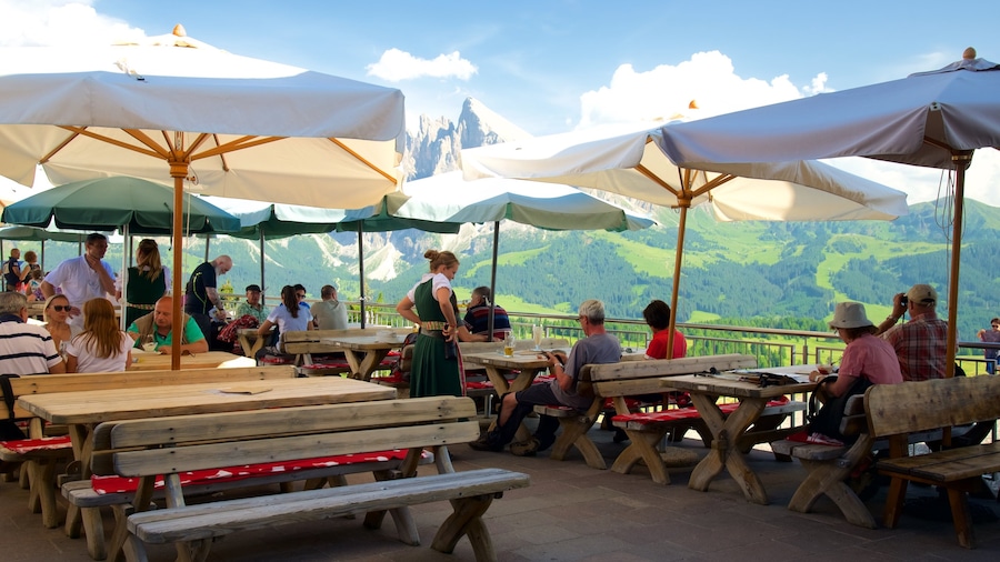 Alpe di Siusi which includes café lifestyle and outdoor eating as well as a large group of people