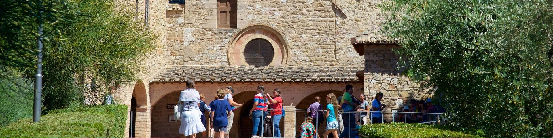San Damiano showing heritage architecture as well as a small group of people