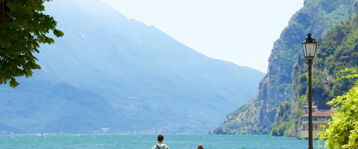 Trentino which includes general coastal views and mountains as well as a small group of people