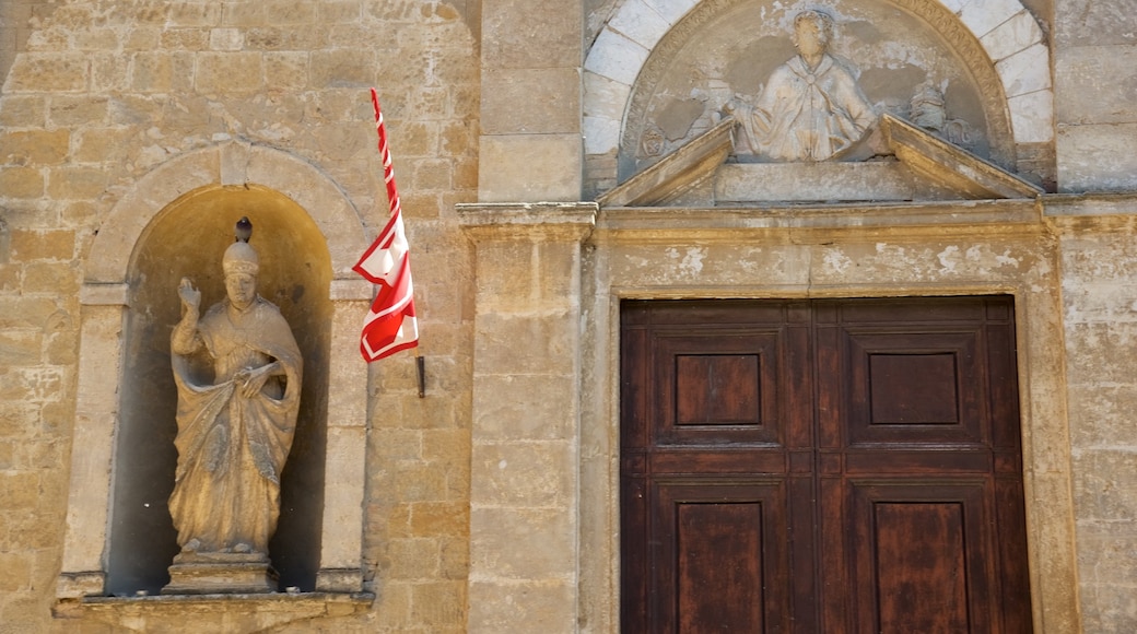 Volterra which includes a statue or sculpture, a church or cathedral and heritage architecture