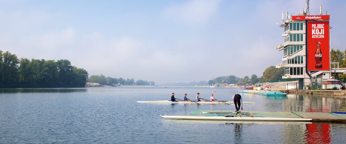 Ada Ciganlija featuring kayaking or canoeing and general coastal views as well as a small group of people