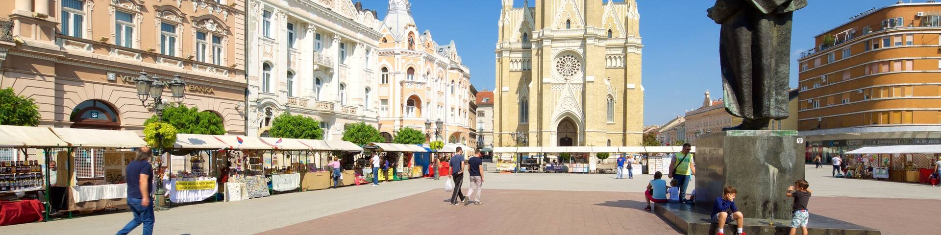 Church of the Virgin Mary showing a statue or sculpture, street scenes and a square or plaza