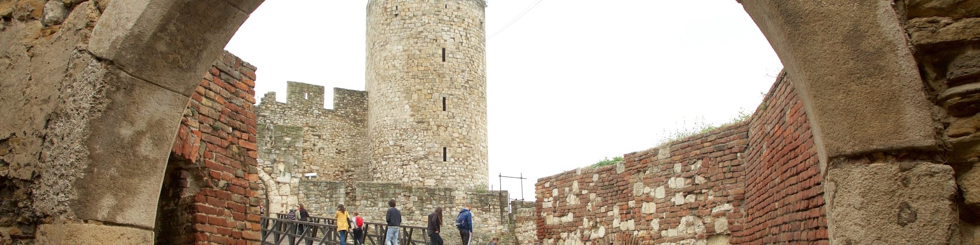 Kalemegdan Citadel featuring a bridge and heritage elements as well as a small group of people