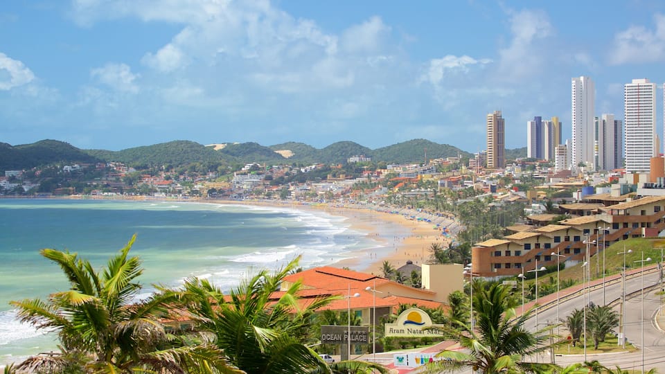 Ponta Negra Beach which includes a coastal town, a skyscraper and a beach
