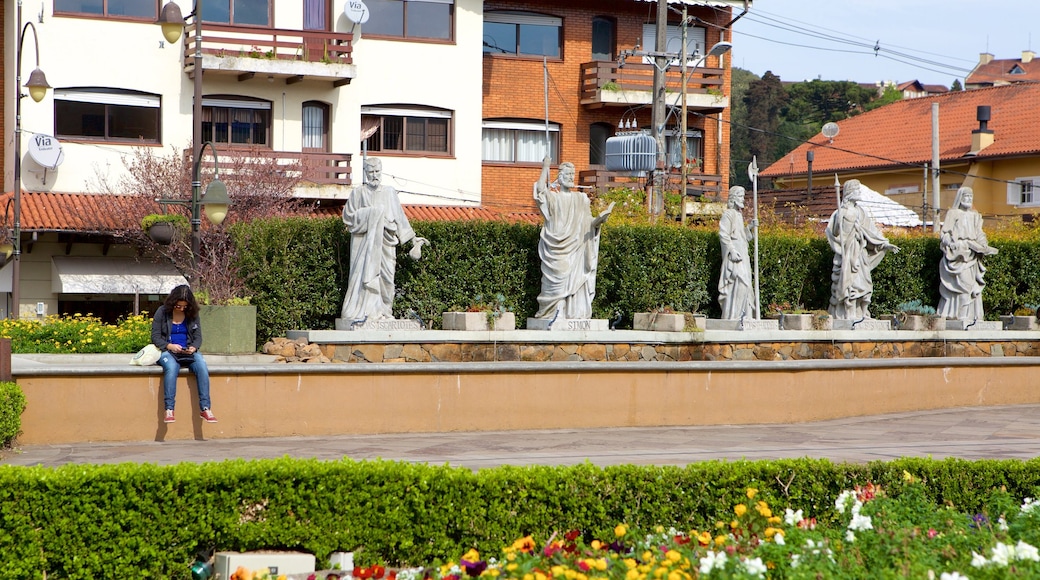 Sao Pedro Church featuring a statue or sculpture and religious aspects as well as an individual female