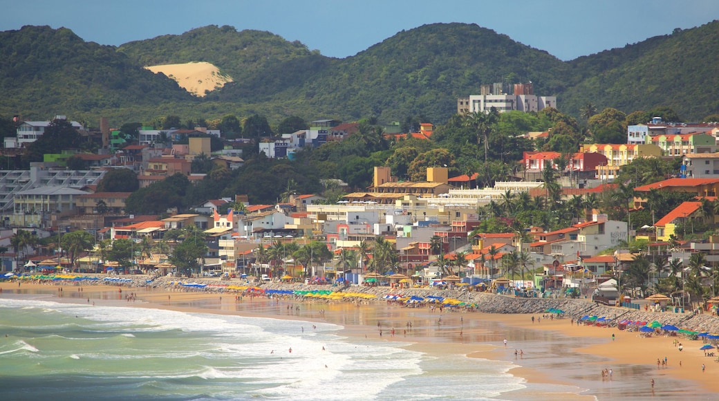 Ponta Negra Beach featuring swimming, a sandy beach and a coastal town