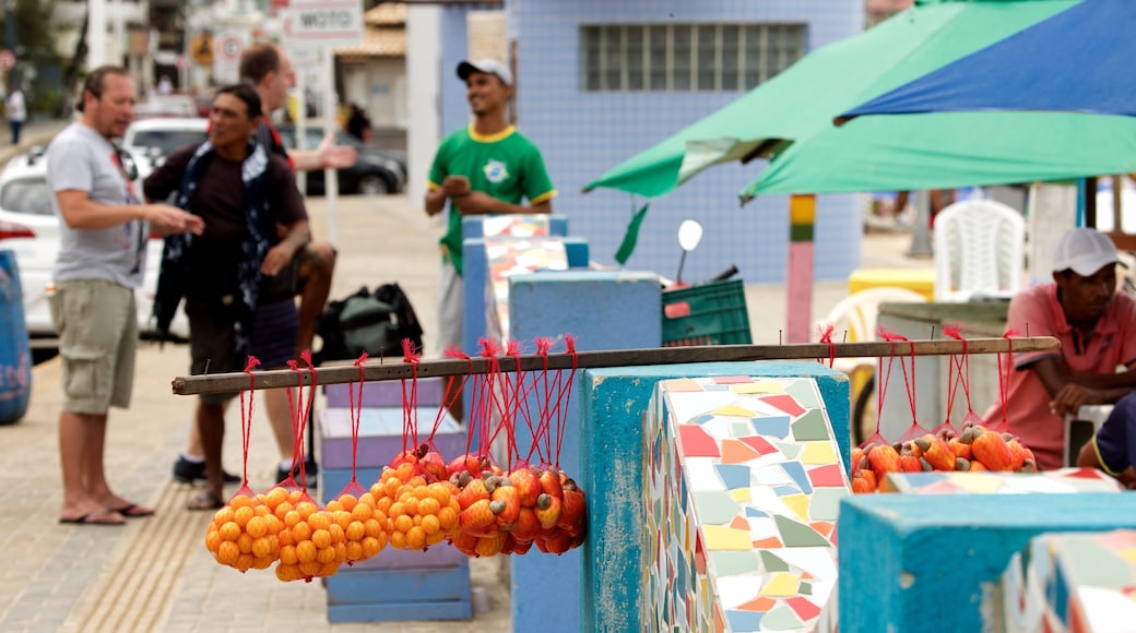 Ponta Negra Beach featuring food as well as a small group of people