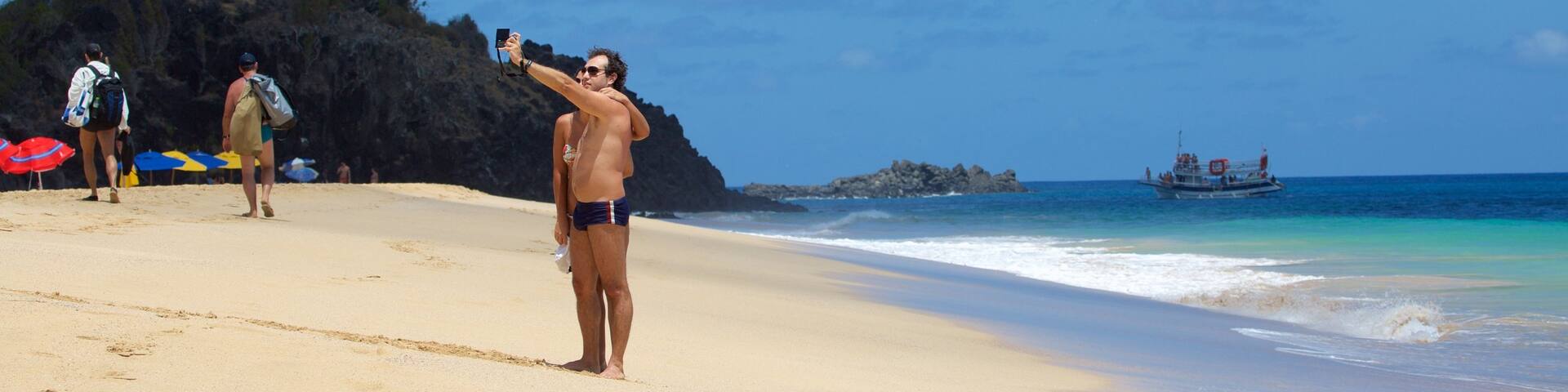 Cacimba do Padre Beach featuring general coastal views and a sandy beach as well as a couple