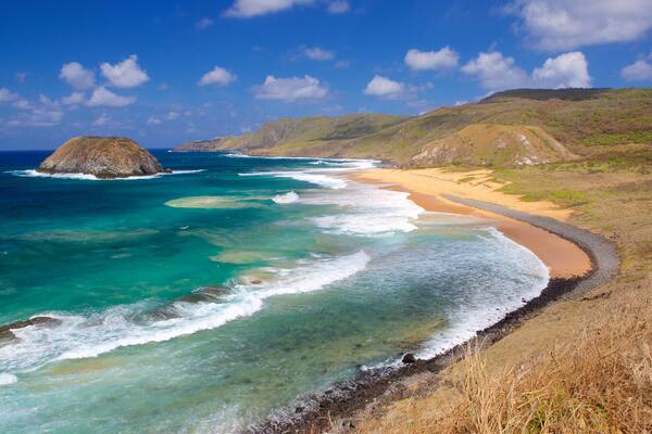 Leao Beach featuring general coastal views, surf and a sandy beach