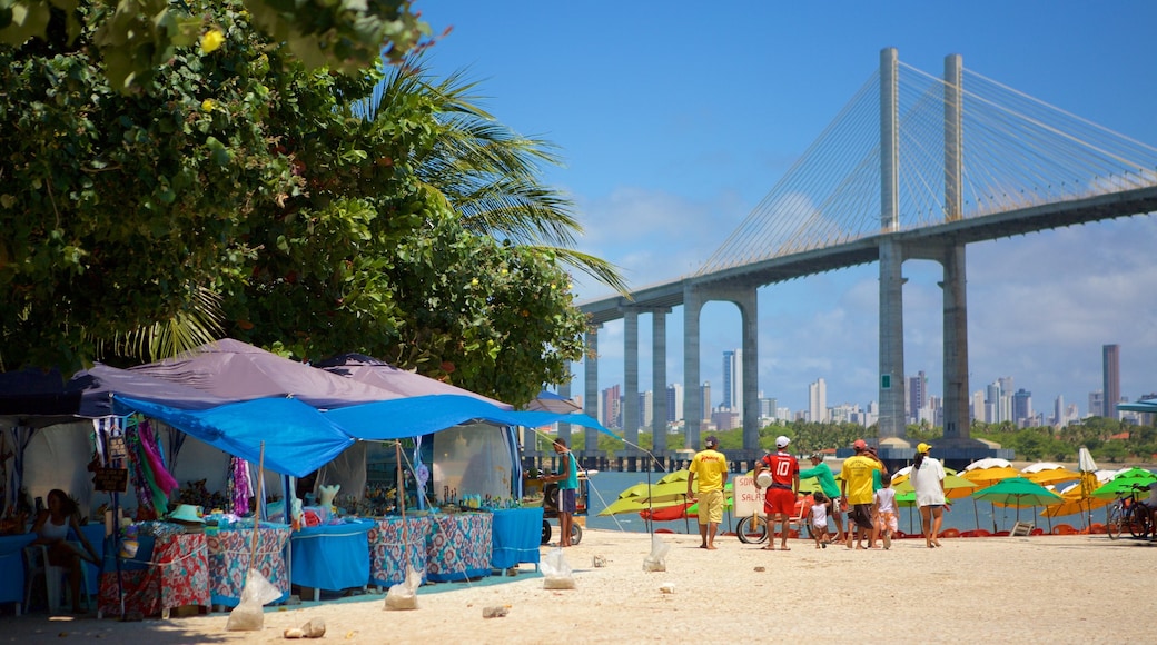 Redinha Beach which includes a bridge and markets as well as a small group of people