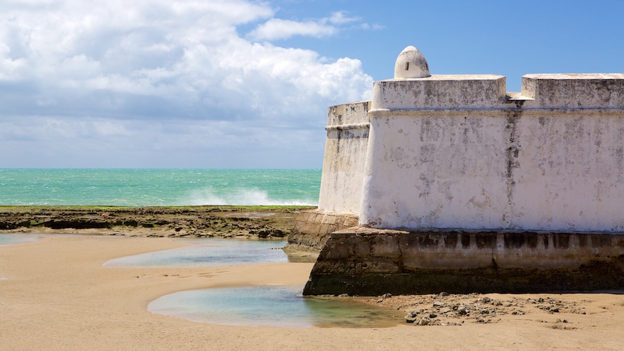 Fort of the Three Kings which includes heritage elements, general coastal views and a beach