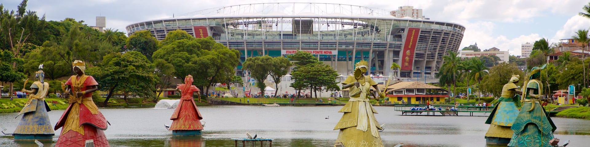 Fonte Nova Stadium which includes a lake or waterhole, a park and a statue or sculpture