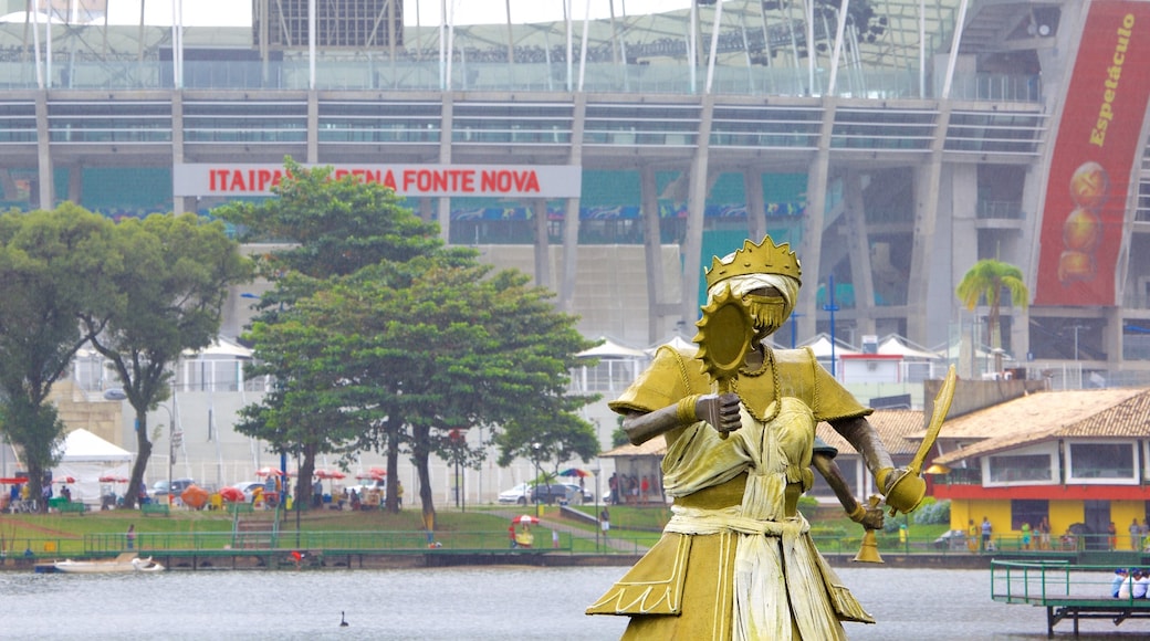 Fonte Nova Stadium which includes a statue or sculpture and a lake or waterhole