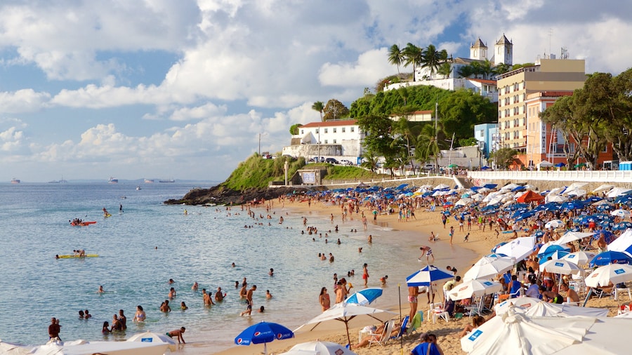 Porto da Barra Beach showing a beach, a coastal town and general coastal views