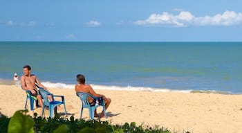 Praia de Taperapuã mostrando paisagens litorâneas, uma praia e ondas