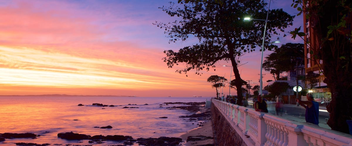 Farol da Barra Beach featuring a sunset, a coastal town and general coastal views