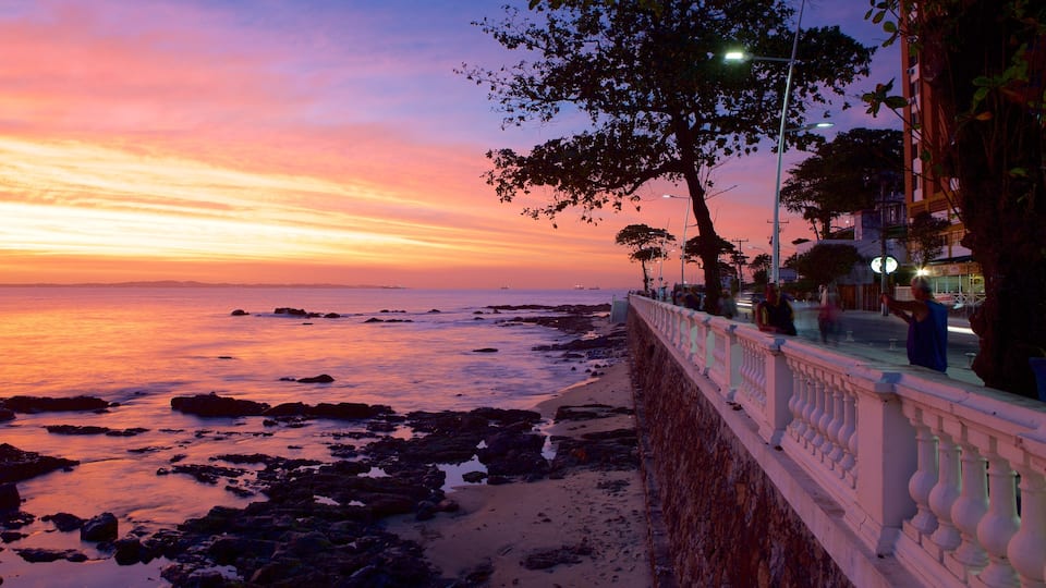 Farol da Barra Beach which includes general coastal views, a coastal town and a sunset