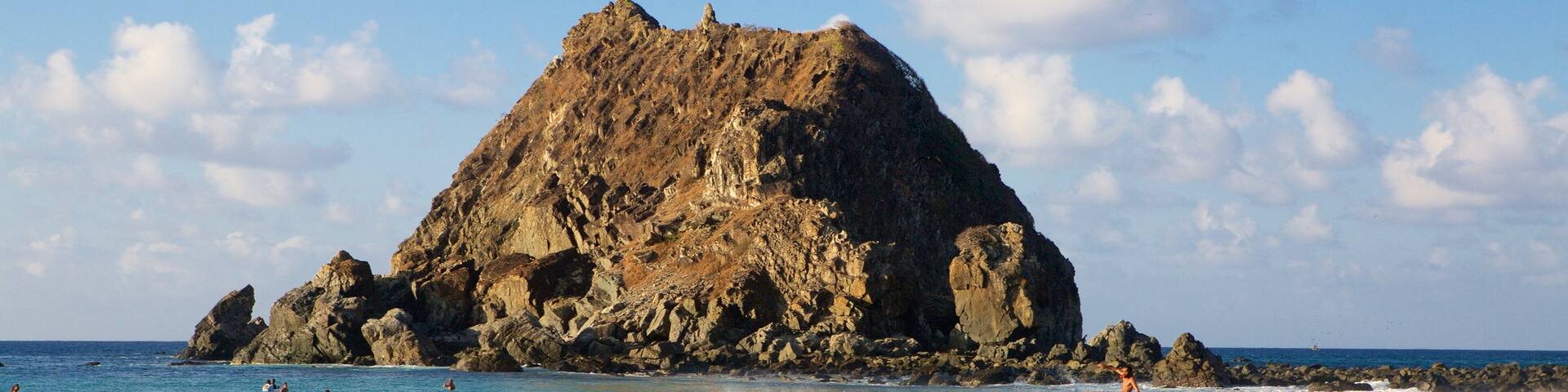 Conceicao Beach featuring surfing, waves and general coastal views