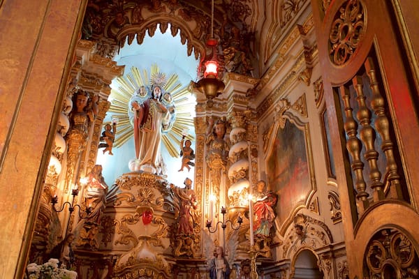 Nossa Senhora de Conceicao da Praia Church featuring a statue or sculpture, interior views and religious elements