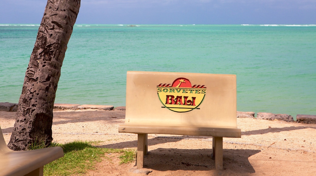 Ponta Verde Beach showing signage, general coastal views and a beach