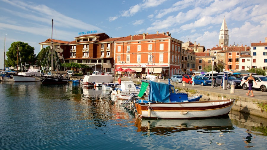 Izola Marina showing a coastal town, boating and a marina