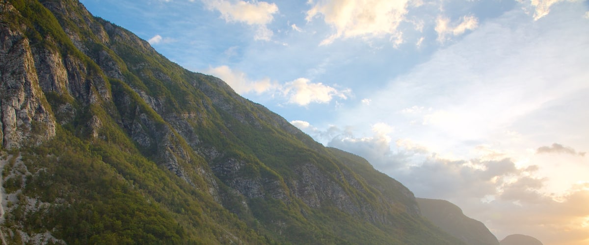 Lake Bohinj showing mountains, a sunset and a lake or waterhole