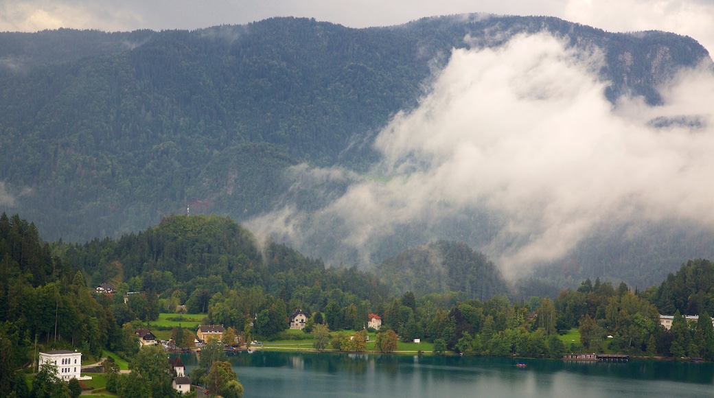 Lake Bled which includes mountains, a lake or waterhole and a small town or village