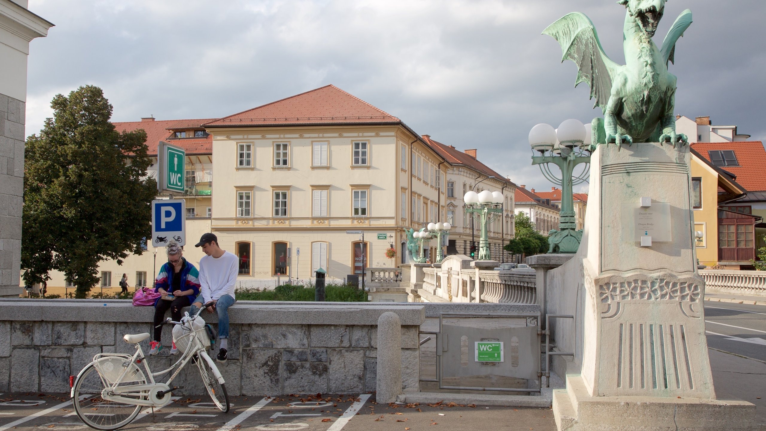 Dragon Bridge featuring a monument and cycling