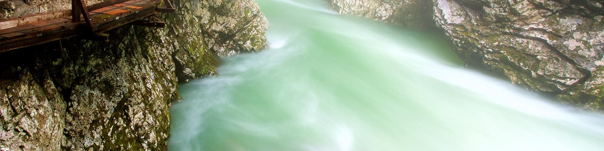 Vintgar Gorge showing a gorge or canyon and mist or fog