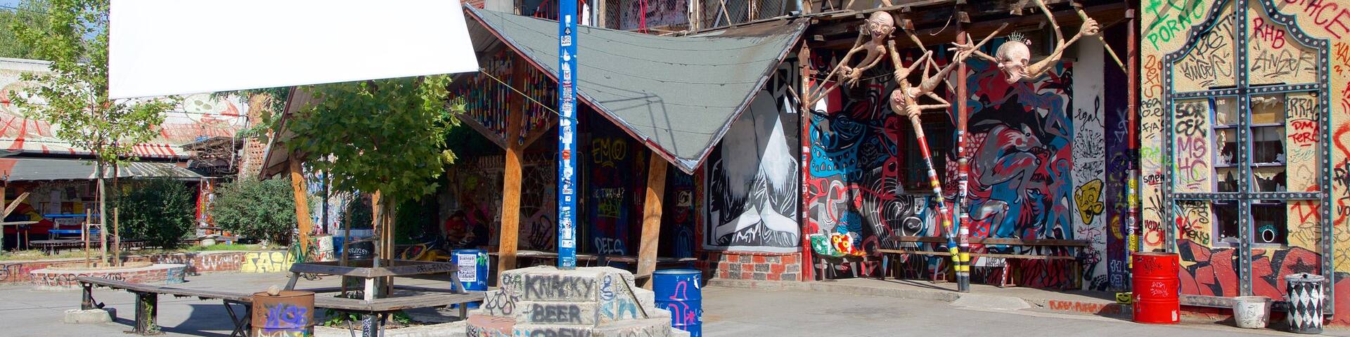 Metelkova which includes a small town or village and outdoor art