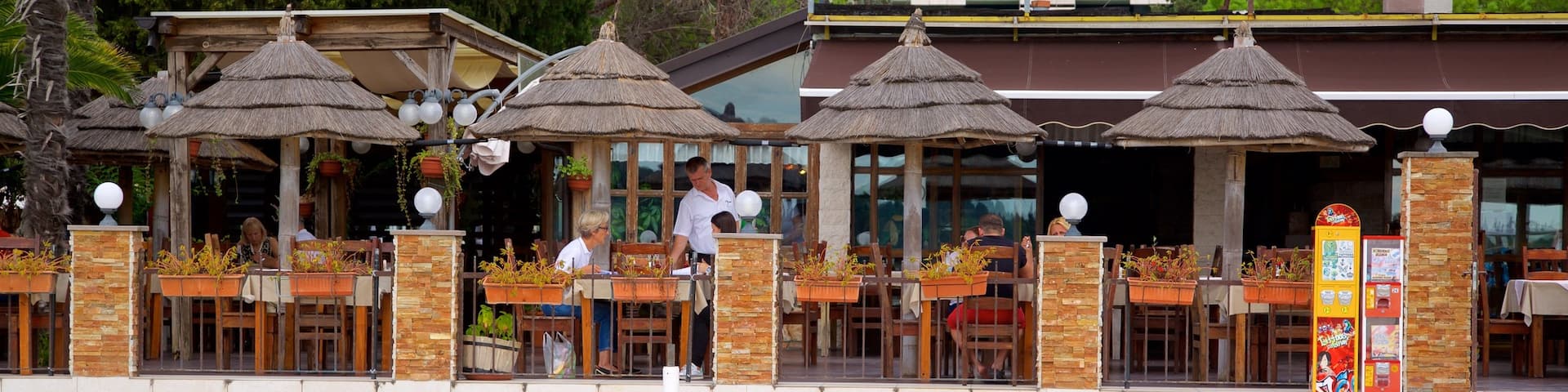 Portoroz Beach which includes a coastal town and outdoor eating