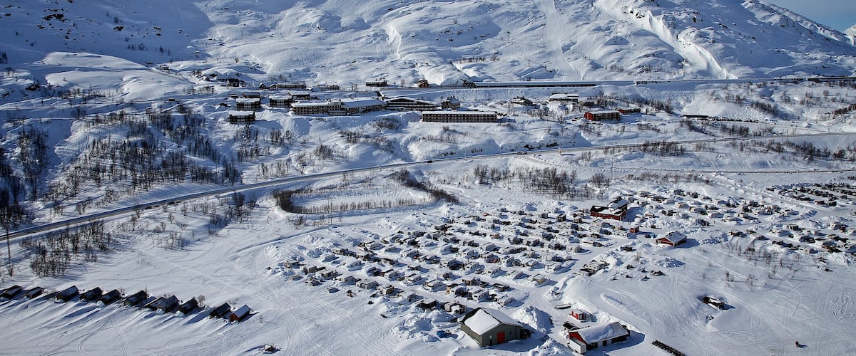 Riksgransen showing snow and a small town or village